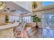 Expansive kitchen area with barstool seating, decorative ceiling, and double doors leading to the outside at 2829 Seabreeze S Dr, Gulfport, FL 33707