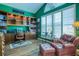 Office with built-in bookshelves and a comfortable leather chair, creating a perfect workspace at 2829 Seabreeze S Dr, Gulfport, FL 33707
