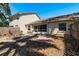 Backyard features stone, trees, mulch, a patio and tall wood fence at 3056 Pepperwood W Ln, Clearwater, FL 33761