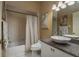 Bright bathroom with a tub and shower combination and vessel sink atop granite countertop at 3056 Pepperwood W Ln, Clearwater, FL 33761