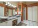 Bathroom showcasing granite countertops, double sinks, and a spacious shower at 3056 Pepperwood W Ln, Clearwater, FL 33761