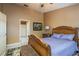 Bedroom showcasing a wooden bed frame and a side table with a lamp at 3056 Pepperwood W Ln, Clearwater, FL 33761