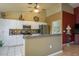 Well-appointed kitchen featuring white cabinets, stainless steel appliances, and a functional layout for easy meal preparation at 3056 Pepperwood W Ln, Clearwater, FL 33761