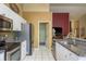 Contemporary kitchen with stainless steel appliances and plenty of countertop space at 3056 Pepperwood W Ln, Clearwater, FL 33761
