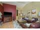 Inviting living room with hardwood floors, comfortable seating, and an entertainment center, creating a cozy atmosphere at 3056 Pepperwood W Ln, Clearwater, FL 33761