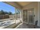 Screened patio featuring a view of a stone garden area, wood fence and lush greenery at 3056 Pepperwood W Ln, Clearwater, FL 33761