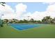 Beautiful blue and green community tennis court with benches for relaxing between matches at 3056 Pepperwood W Ln, Clearwater, FL 33761