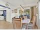 Bright dining area with chandelier and sliding glass doors leading to lanai at 3229 40Th S Ln # A, St Petersburg, FL 33711