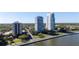 Aerial view of condos along the water, showcasing the surrounding landscape and neighborhood at 3435 Bayshore Blvd # 1401S, Tampa, FL 33629