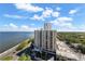 Stunning aerial view highlighting the building's location by the water with lush greenery surroundings at 3435 Bayshore Blvd # 1401S, Tampa, FL 33629