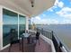 Inviting balcony with a bistro set offering panoramic waterfront and city views at 3435 Bayshore Blvd # 1401S, Tampa, FL 33629