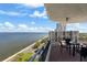 Balcony view with table and chairs, overlooking the coast and the skyline at 3435 Bayshore Blvd # 1401S, Tampa, FL 33629