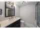 Bathroom featuring a modern vanity with a cream countertop and a dark wood cabinet and a shower with glass door at 3435 Bayshore Blvd # 1401S, Tampa, FL 33629