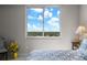 Bedroom with a large window and beautiful views of trees and nice blue skies at 3435 Bayshore Blvd # 1401S, Tampa, FL 33629