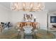 Elegant dining room boasts a decorative chandelier and seating for six at 3435 Bayshore Blvd # 1401S, Tampa, FL 33629