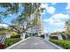 Wide shot of the driveway entrance of a residential building with lush landscaping and building view at 3435 Bayshore Blvd # 1401S, Tampa, FL 33629