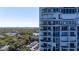 Exterior view of a condo with balconies and a stunning view of the trees and city at 3435 Bayshore Blvd # 1401S, Tampa, FL 33629