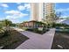 Beautifully landscaped exterior showcasing manicured gardens, and a charming building with an inviting walkway at 3435 Bayshore Blvd # 1401S, Tampa, FL 33629