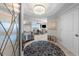 Foyer with chandelier, mirrored console, round rug, and view of water from living room at 3435 Bayshore Blvd # 1401S, Tampa, FL 33629