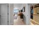 Hallway view leading to the main bedroom and walk-in closet with tiled floors and neutral wall paint at 3435 Bayshore Blvd # 1401S, Tampa, FL 33629