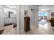 Hallway leading to a bathroom and main bedroom with tiled floors and neutral wall paint at 3435 Bayshore Blvd # 1401S, Tampa, FL 33629