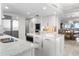 Gourmet kitchen with stainless appliances flows into the formal dining room at 3435 Bayshore Blvd # 1401S, Tampa, FL 33629