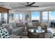Open concept living room with ceiling fan, water views, and modern furniture at 3435 Bayshore Blvd # 1401S, Tampa, FL 33629