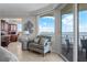 Living area with stunning water views, wet bar, comfortable seating, and a peek at the city skyline from the windows at 3435 Bayshore Blvd # 1401S, Tampa, FL 33629