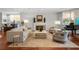 Living room showcasing neutral furniture, a fireplace, and a glimpse of the outside view at 3435 Bayshore Blvd # 1401S, Tampa, FL 33629