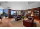 Luxurious living room boasting wood paneling, a fireplace, and ocean views at 3435 Bayshore Blvd # 1401S, Tampa, FL 33629