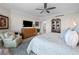 Bright main bedroom with a ceiling fan and a comfortable sitting area at 3435 Bayshore Blvd # 1401S, Tampa, FL 33629