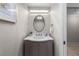 Stylish powder room featuring a unique vanity with an oval mirror and decorative lighting at 3435 Bayshore Blvd # 1401S, Tampa, FL 33629