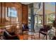 Elegant sitting area featuring rich wood paneling, plush seating, and a captivating view of the outdoors at 3435 Bayshore Blvd # 1401S, Tampa, FL 33629