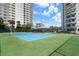 Brightly colored tennis court surrounded by residential buildings, ideal for sports enthusiasts at 3435 Bayshore Blvd # 1401S, Tampa, FL 33629
