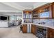 Wet bar with custom cabinets, stone backsplash, and stainless steel appliances at 3435 Bayshore Blvd # 1401S, Tampa, FL 33629