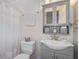 Clean bathroom with gray vanity, shower, and updated fixtures at 378 Tennessee Ave, Crystal Beach, FL 34681