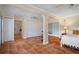 Spacious bedroom with terra cotta floors, white closets, and natural light at 378 Tennessee Ave, Crystal Beach, FL 34681