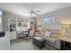 Cozy bedroom with a fan, desk area, and couch, perfect for relaxing and study at 378 Tennessee Ave, Crystal Beach, FL 34681