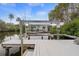 A functional boat lift stands ready for your vessel, providing easy access to the water at 378 Tennessee Ave, Crystal Beach, FL 34681