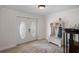 Inviting entryway with decorative double doors, a coat rack, and a stylish area rug at 378 Tennessee Ave, Crystal Beach, FL 34681