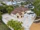 Stunning waterfront home featuring an expansive driveway, three-car garage and outdoor living with an elevated deck at 378 Tennessee Ave, Crystal Beach, FL 34681
