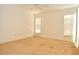 Spacious bedroom with multiple windows offering natural light, and neutral carpeting at 3876 Darston St, Palm Harbor, FL 34685