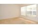 A bright bedroom offers natural light through a window with blinds at 3876 Darston St, Palm Harbor, FL 34685