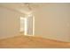Bright bedroom with natural light, ceiling fan, and neutral carpeting at 3876 Darston St, Palm Harbor, FL 34685