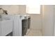 Modern laundry room equipped with new washer and dryer units for convenient laundry tasks at 3876 Darston St, Palm Harbor, FL 34685