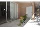 Covered patio space with sliding glass doors and plants, offering an outdoor living area at 3876 Darston St, Palm Harbor, FL 34685