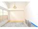 Unfinished room with a chandelier, ample natural light, and a large window at 3876 Darston St, Palm Harbor, FL 34685