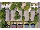 Aerial view of townhomes showcases roof lines and landscaping in a well-maintained community at 408 S Arrawana Ave # B4, Tampa, FL 33609