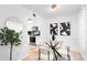 Bright dining area features modern art, a glass table, seating for four, and tile floors at 408 S Arrawana Ave # B4, Tampa, FL 33609