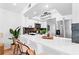 Chic kitchen bar with seating, featuring a view into the living area and modern appliances at 408 S Arrawana Ave # B4, Tampa, FL 33609